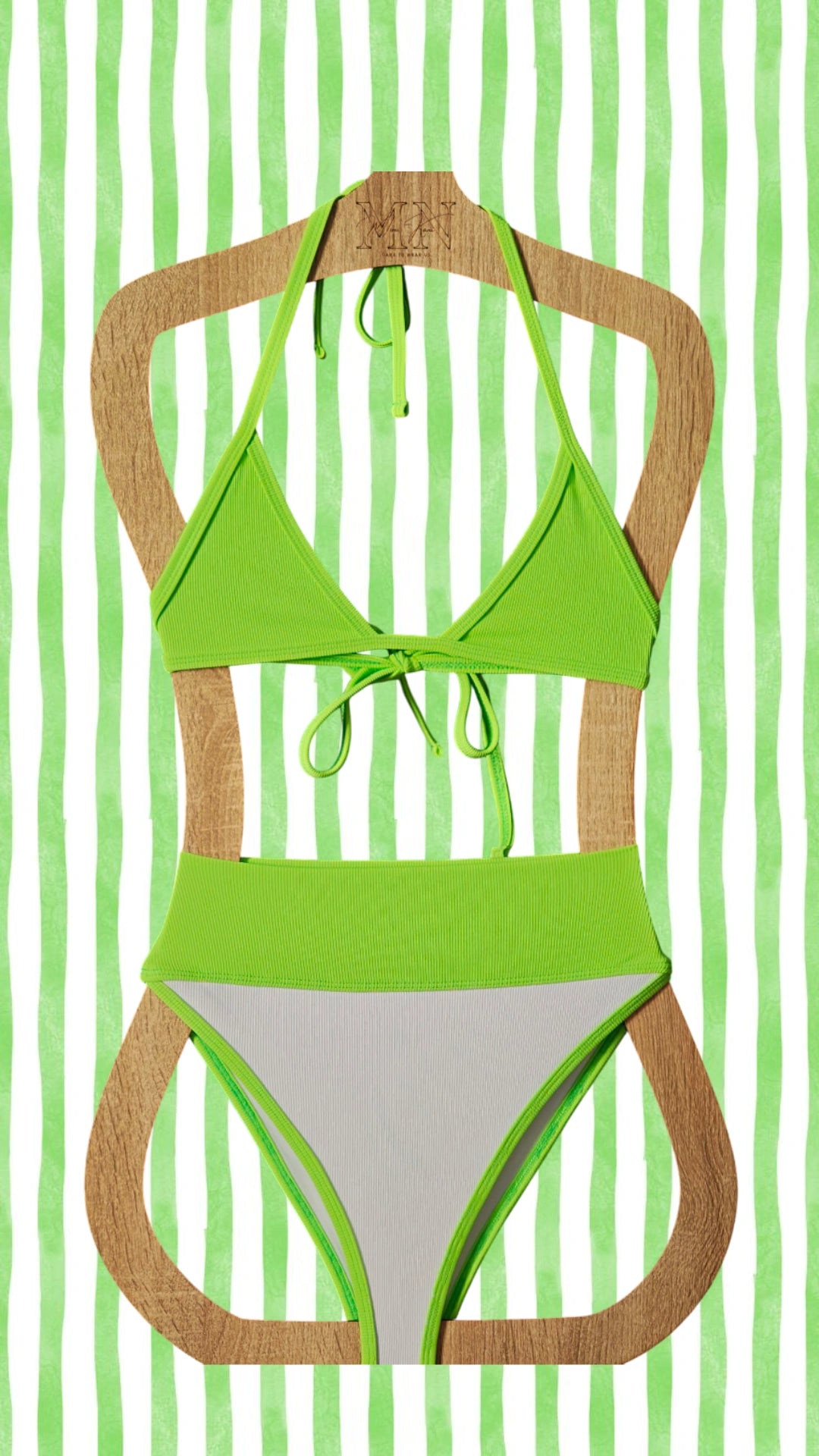 Green bikini on a wooden hanger against a green striped background