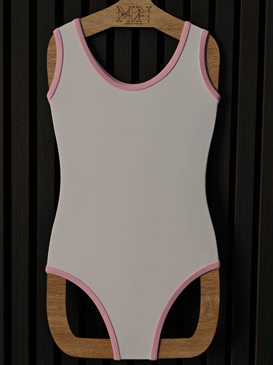 White one-piece swimwear with baby pink edges from ribbed fabrics, for kids 2-10 years old 