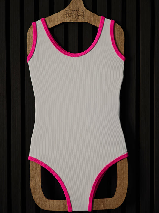 White one-piece swimwear with neon pink edges for kids age 2 to 10, made of ribbed fabrics