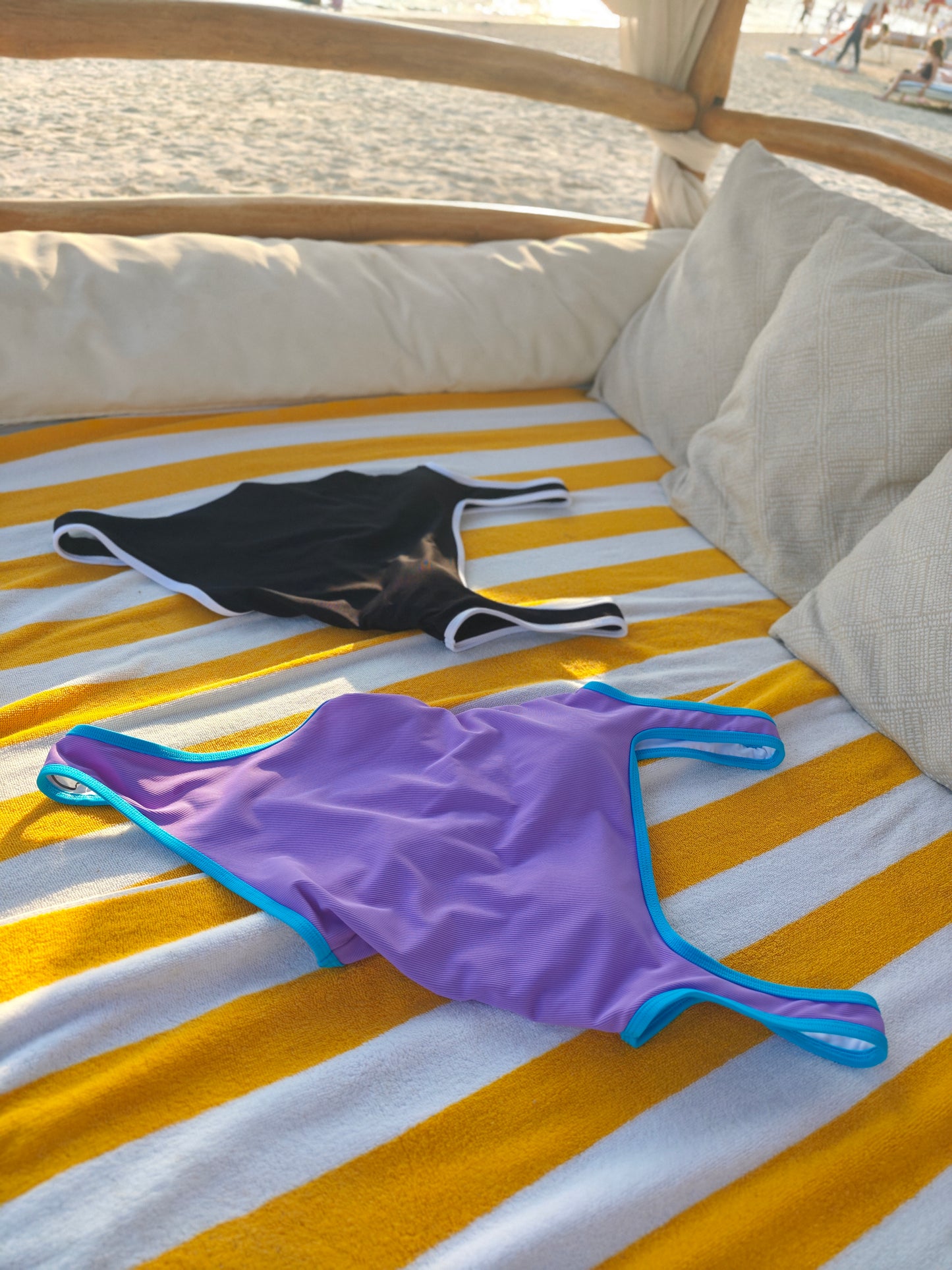 Close-up of Patisserie Mix swimsuit fabric – smooth stretch material with pink, mint, and lavender panels

