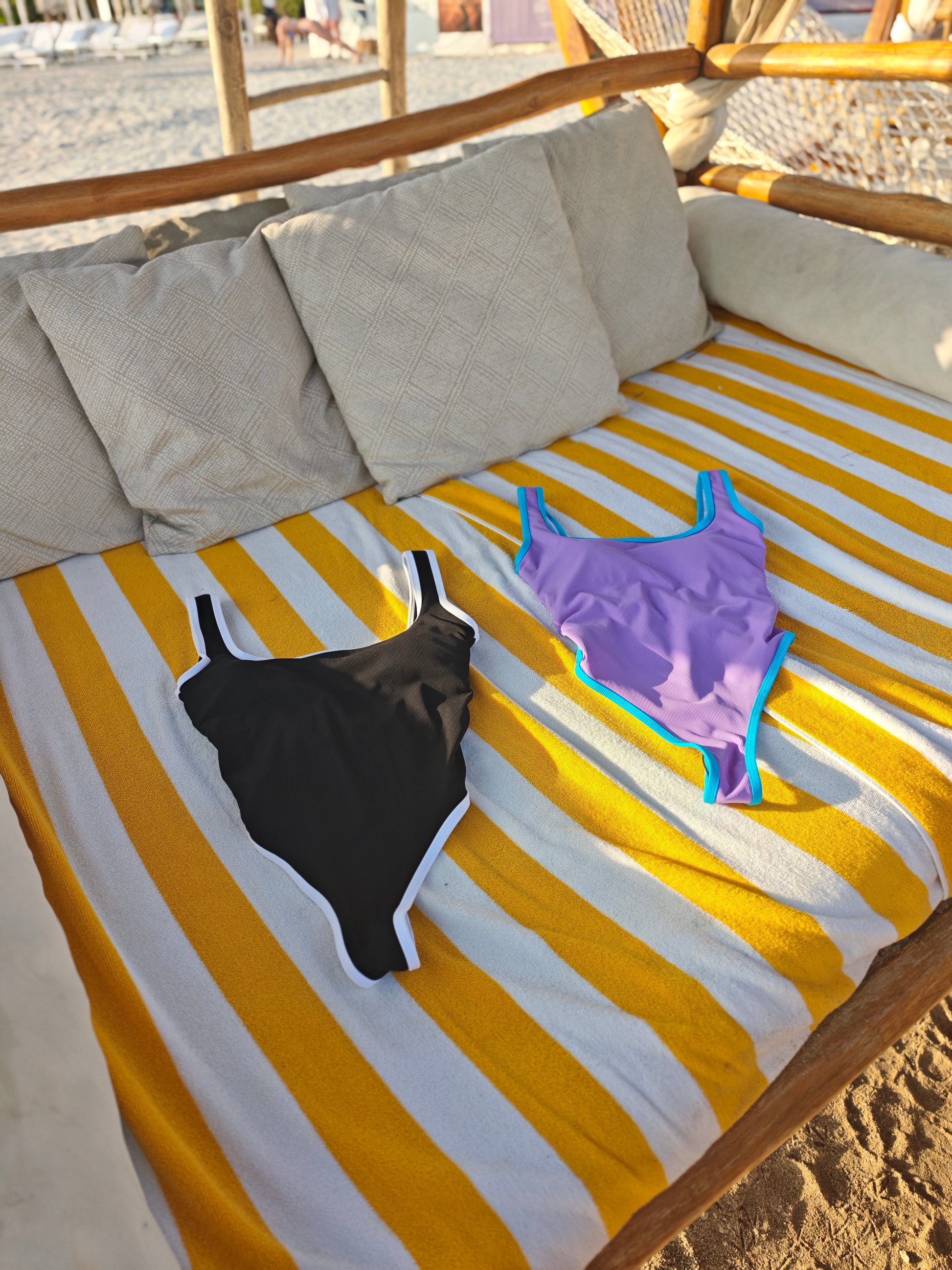Close-up of Patisserie Mix swimsuit fabric – smooth stretch material with pink, mint, and lavender panels

